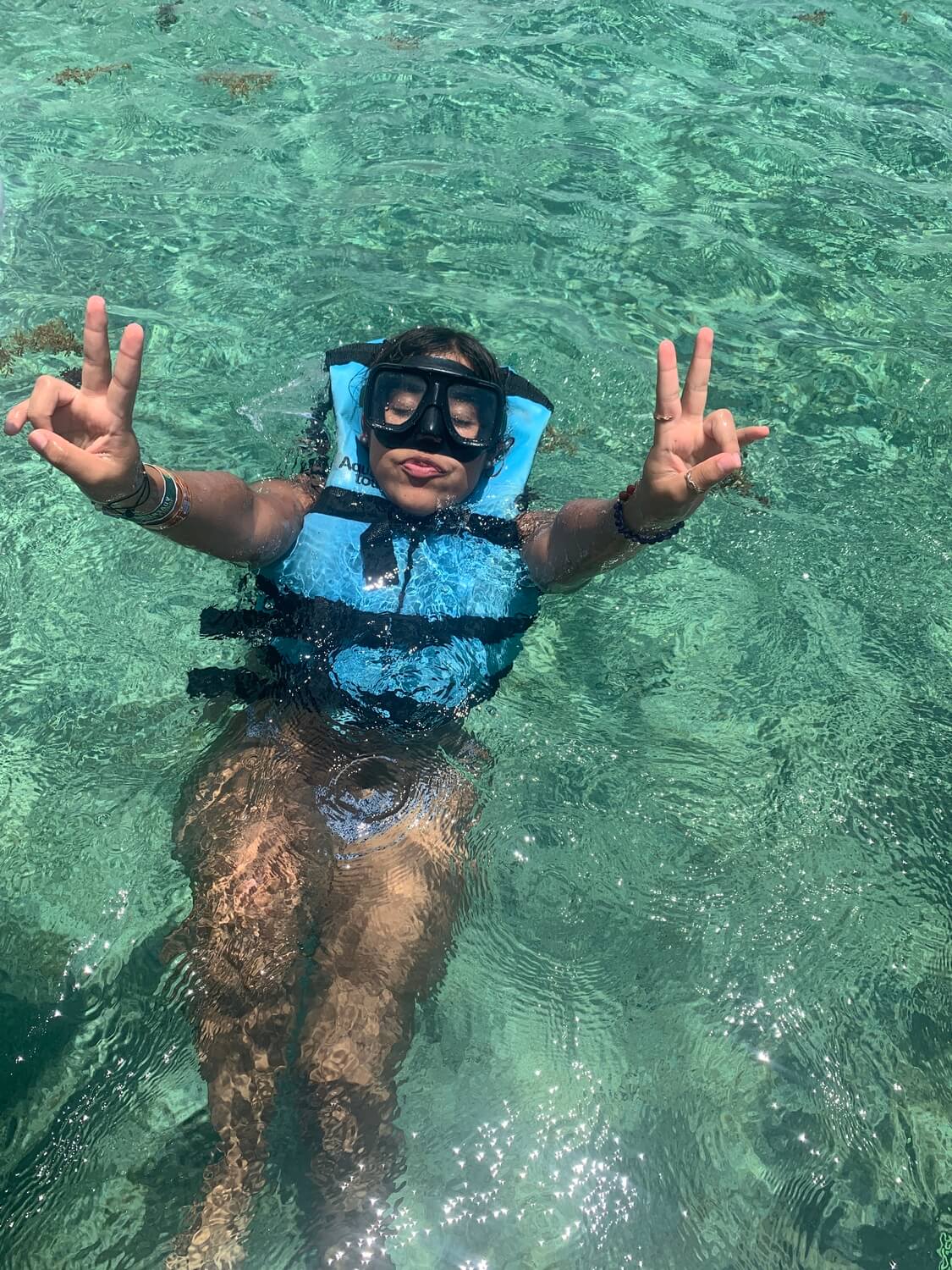 girl on a snorkeling tour in cancun with advance purchase