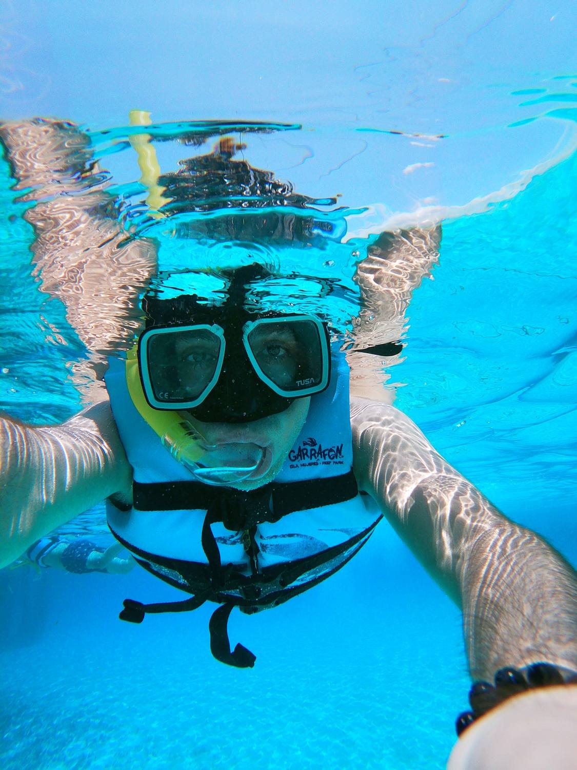 snorkeling in a coral reef on Isla Mujeres