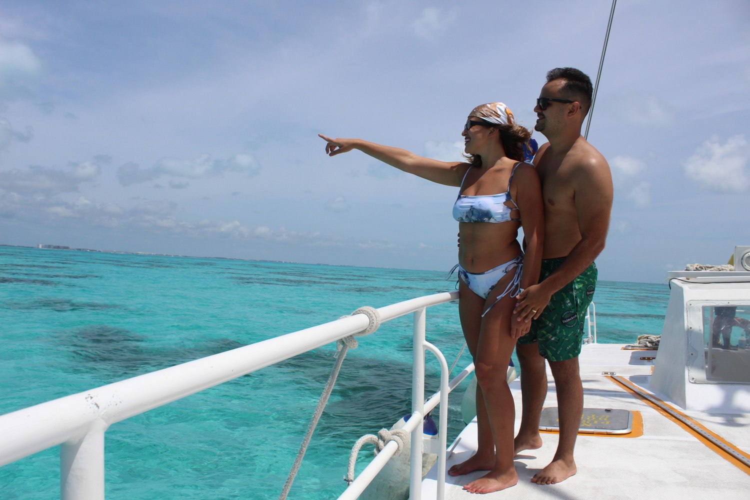 couple on a catamaran tour in cancun