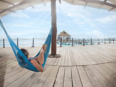 Person lying in a hammock on Isla Mujeres, Mexico