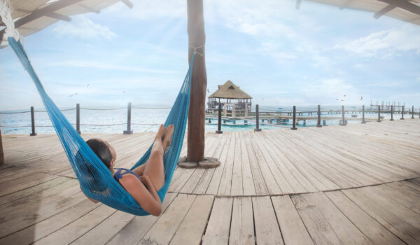 Person lying in a hammock on Isla Mujeres, Mexico